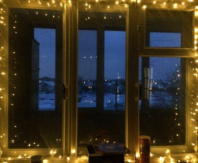 My Christmas-lit, snowy window